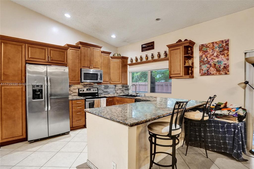 Photo of 2484 NW 95th Ave, Coral Springs, FL 33065 (MLS # A11729336)