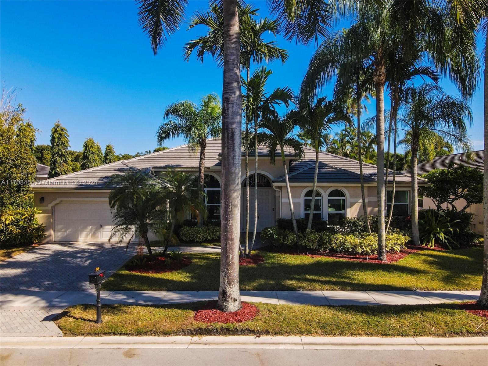 Fully Renovated Home in Weston Hills CC! This 5-bedroom, 4.5-bathroom home with an office and den offers modern elegance with a NEW ROOF (23), FULLY IMPACT WINDOWS (24), and a NEW HVAC system (22). The gourmet kitchen is a chef's paradise, featuring granite countertops, a center island, brand-new stainless steel appliances, a wine fridge, an osmosis-alkaline water system, and an oversized pantry. Enjoy 24x24 marble flooring in the living areas and European wooden floors in the owner’s suite, office, and guest room. Step outside to your private oasis, complete with a resurfaced Diamond Brite freeform pool with a fountain, a new pool deck, and a covered patio with a cabana bath. Luxury, style, and comfort await—schedule your tour today!