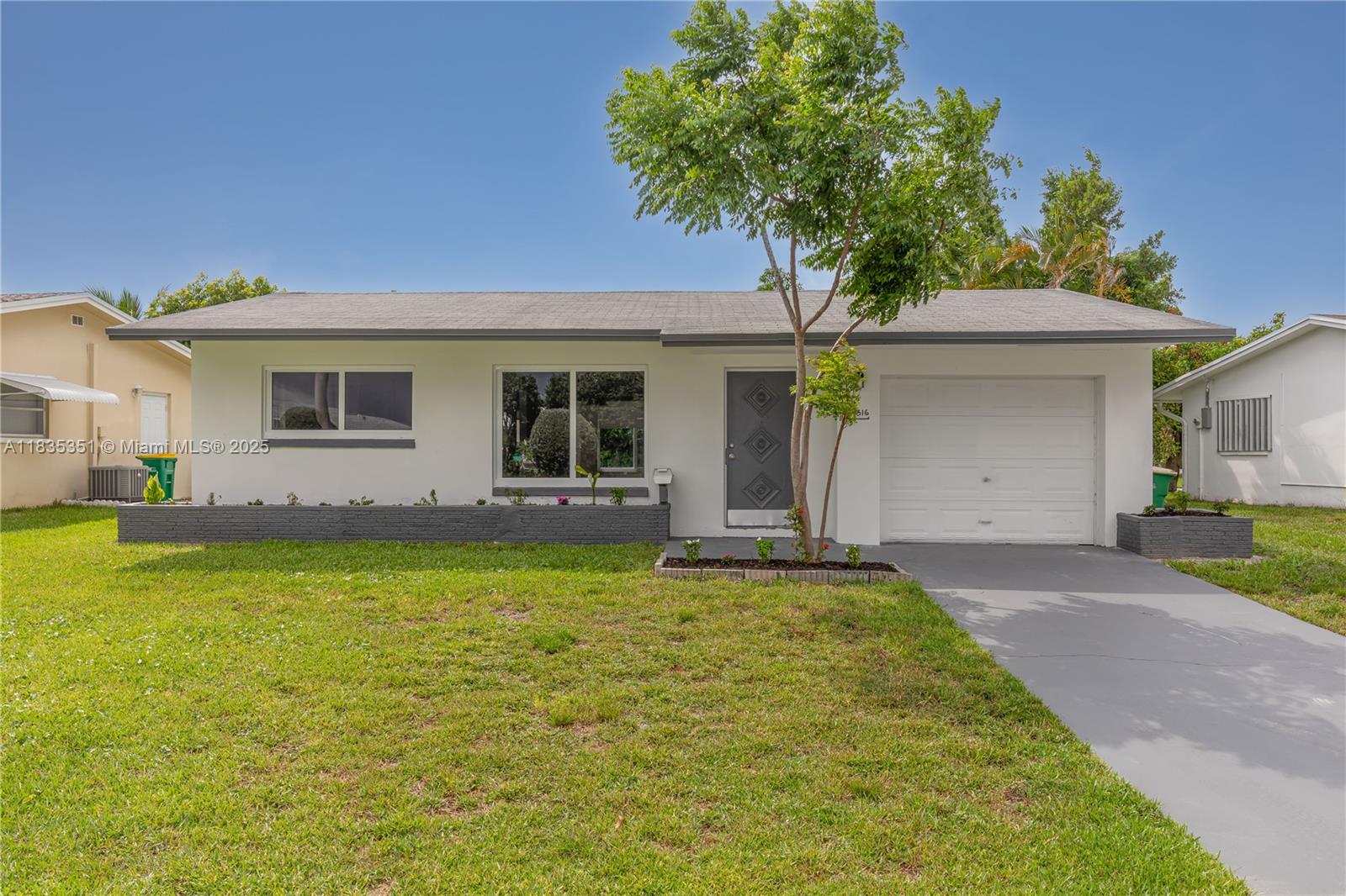 Impeccable 2 BR/2BA home with a 1 car garage in the sought-after 55+ Mainlands of Tamarac. This home features a spacious Florida room that can be used as additional living space or converted into a 3rd bedroom. Recent upgrades include new impact windows, new electrical panel, new tankless water heater, and fresh interior paint. Both bathrooms remodeled. Updated kitchen offers white cabinetry and stainless steel appliances. Natural light throughout, creating a warm & airy ambience. 100% waterproof vinyl plank flooring throughout. Screened-in patio, roof 2013, and AC 2019. Conveniently located near shopping, restaurants, and less than 30 minutes drive to the beach!! Don’t miss the opportunity to live in this active and well-maintained 55+ community!!