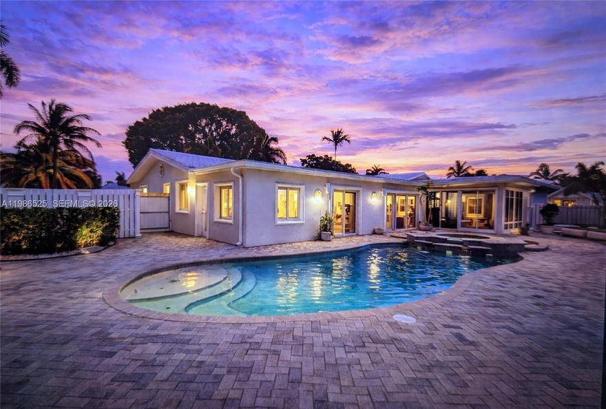 Beautifully updated 3-bedroom, 2-bath pool home on a desirable corner lot in Fort Lauderdale offering true resort-style living. Move-in ready and freshly painted with new flooring in two bedrooms, this well-maintained property features neutral finishes, a 1-car attached garage, full impact windows and doors, and an inside laundry room with washer and dryer. The open kitchen with a large bar flows into the family room and overlooks the backyard, creating an ideal space for everyday living and entertaining. Step outside to your private oasis with a covered Florida room, outdoor kitchen, resort-style pool with spa, and fully fenced yard—perfect for relaxing or entertaining year-round. Pet-friendly. The primary suite includes a walk-in closet with built-in shelving. The third bedroom is smaller in size with a private exterior entrance, ideal for a home office, guest space, or flexible use. Conveniently located minutes to the beach, shopping, dining, and I-95. Rent includes lawn care, pool maintenance, and pest control. Owner requires credit report, proof of income, and back ground check. Some photos may include AI generated virtual staging.