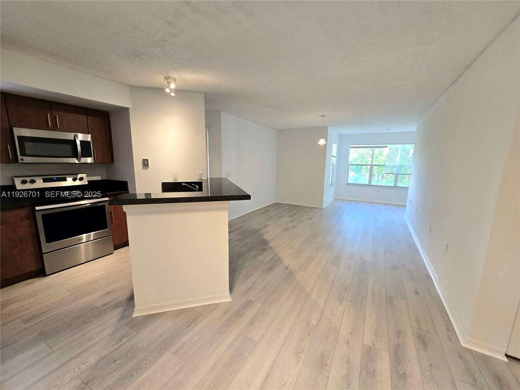 Photo of 13060 Vista Isles Dr #212, Sunrise, FL 33325 (MLS # A11926701)