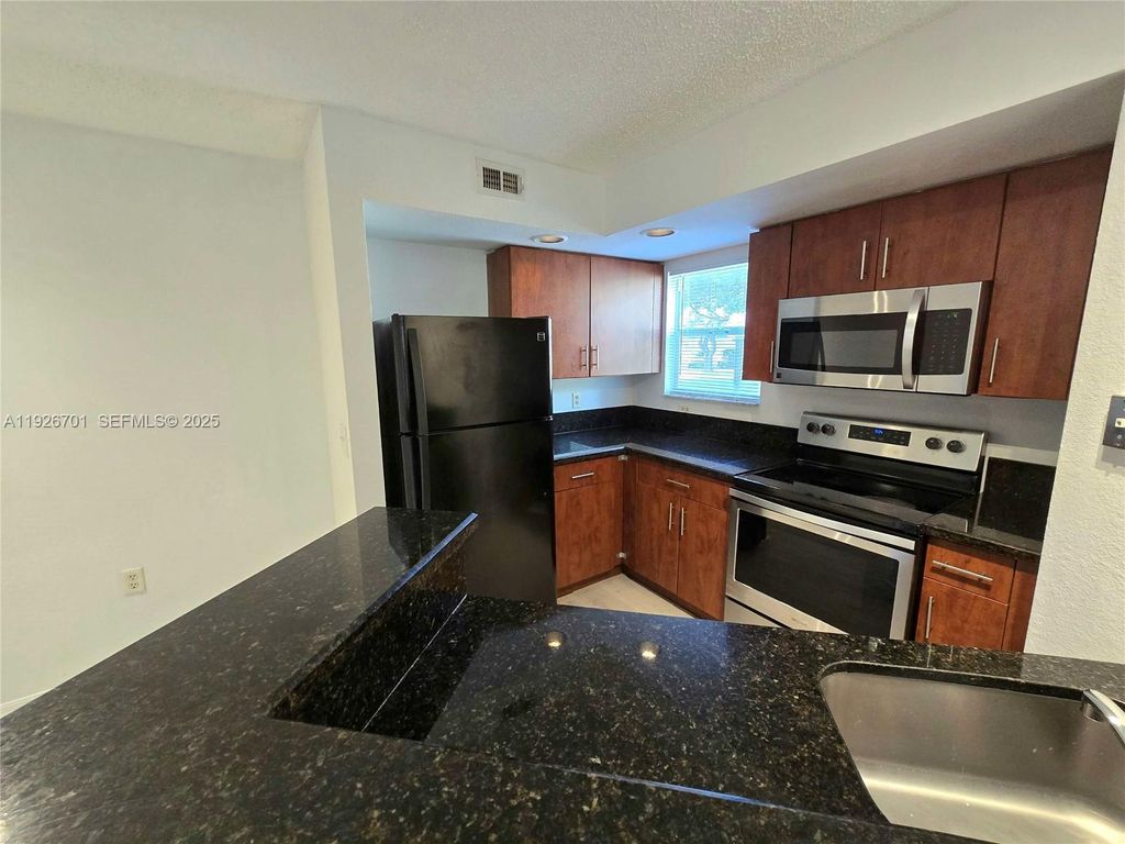 Photo of 13060 Vista Isles Dr #212, Sunrise, FL 33325 (MLS # A11926701)