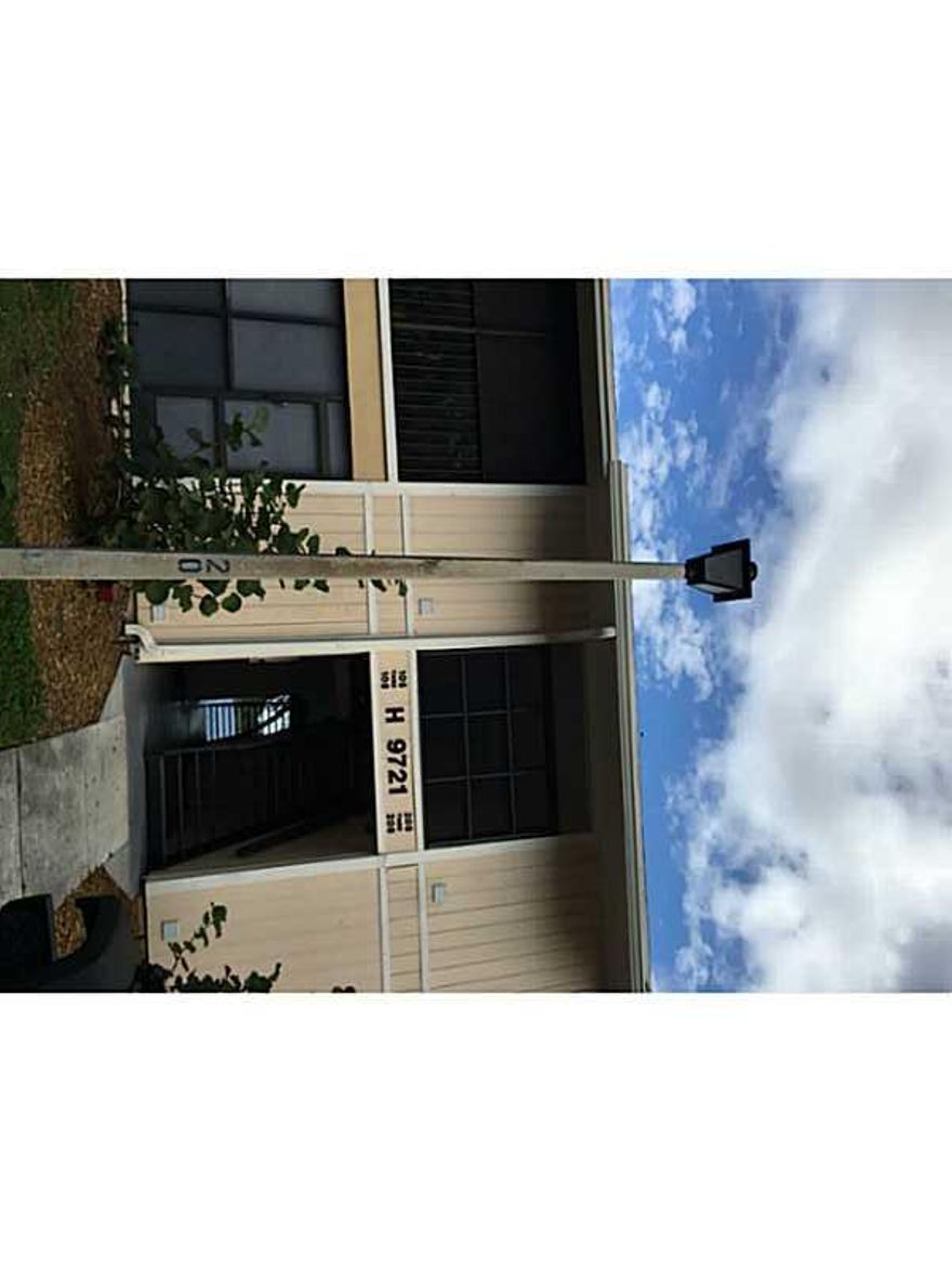 Well kept beautiful 2 bed 2 bath condo with lakeview located in the hammocks. It features a large living and dining area with ceramic tiles throughout the property. Very spacious kitchen  with full size washer & dryer. Screened-in terrace that overlooks t he lake One assigned parking + plenty of guests. Enjoy this community with 3 pools, and tennis courts. New kitchen and appliances. Bathrooms have been upgraded.