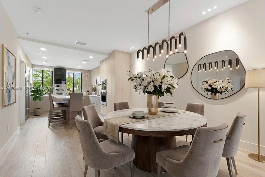 Discover refined island living at The Villas at Bay Harbor, an intimate gated community of only 18 townhomes tucked into the heart of Bay Harbor Islands. Completely reimagined in 2022 and delivered fully furnished with designer selections, this 4-story townhome offers 2,675 SF of sophisticated living, converted-5 bedrooms, 4 bathrooms, and the rare convenience of a private interior elevator servicing every floor. The entry level welcomes you with a versatile den and full bath — effortlessly converted to a 5th bedroom — opening onto a tranquil outdoor patio. Ascend to the second floor, where a brand-new chef's kitchen anchored by marble countertops and a generous center island flows gracefully into the light-filled living and dining areas. The third level hosts three well-appointed bedrooms and two baths, while the entire fourth floor is reserved for an expansive primary suite featuring a walk-in closet and a private rooftop terrace — an ideal perch for sunrise coffee or evening cocktails. Residents enjoy access to a renovated rooftop pool and fitness center. Ideally positioned just moments from the beach, world-class shopping at Bal Harbour Shops, celebrated dining, houses of worship, and the A-rated Bay Harbor K-8 Center.