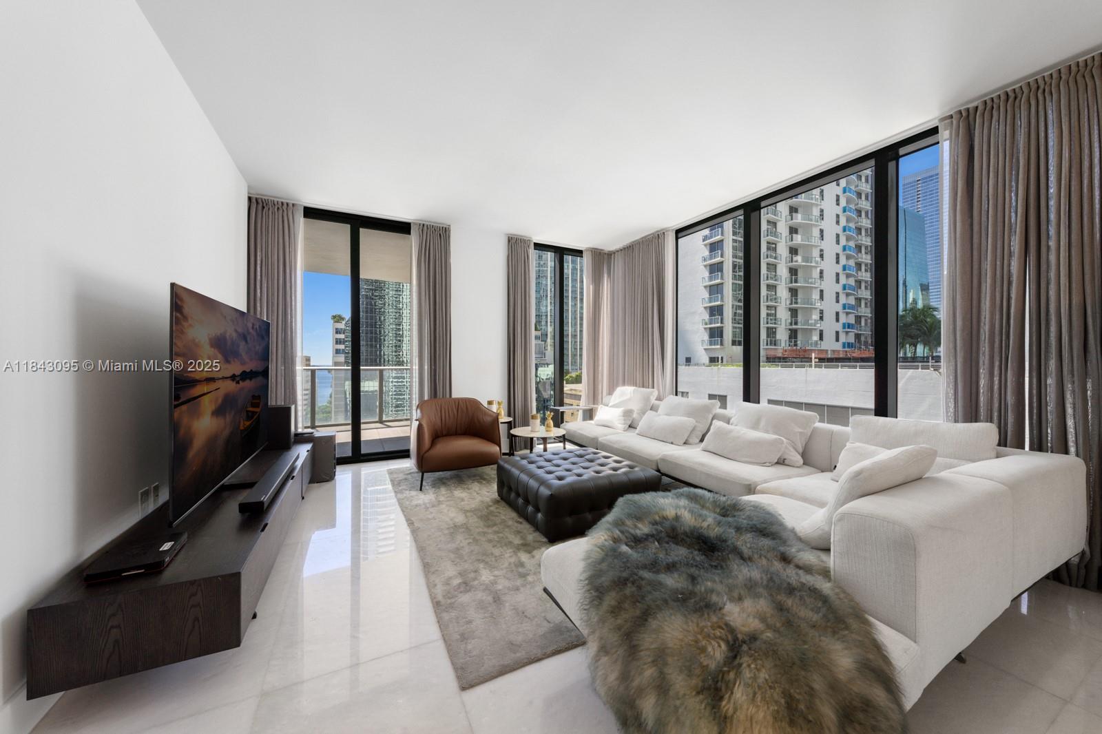 Welcome to this beautifully renovated corner residence in the heart of Brickell, blending luxury, functionality, and incredible views. Located in the prestigious 1010 Brickell, this spacious 1.700 SF+ unit offers 3 generous bedrooms, 3 full bathrooms, and an oversized den—perfect for modern day living. Enjoy stunning views of Biscayne Bay and the Brickell skyline through floor-to-ceiling windows. Marble-look tile floors and custom closets add warmth and style. The sleek kitchen features high-end appliances and refined finishes, ideal for both daily life and entertaining. Amenities include a rooftop pool, state-of-the-art gym, spa, private theater, children’s play areas, and more. Steps from Brickell City Centre, fine dining, and top entertainment. Schedule your private showing today!