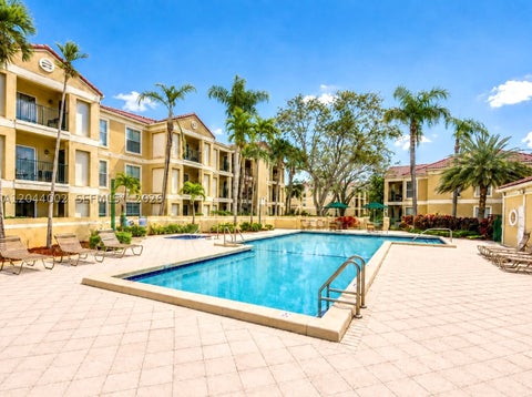 Photo of 977 Riverside Dr #220, Coral Springs, FL 33071 (MLS # A12044002)