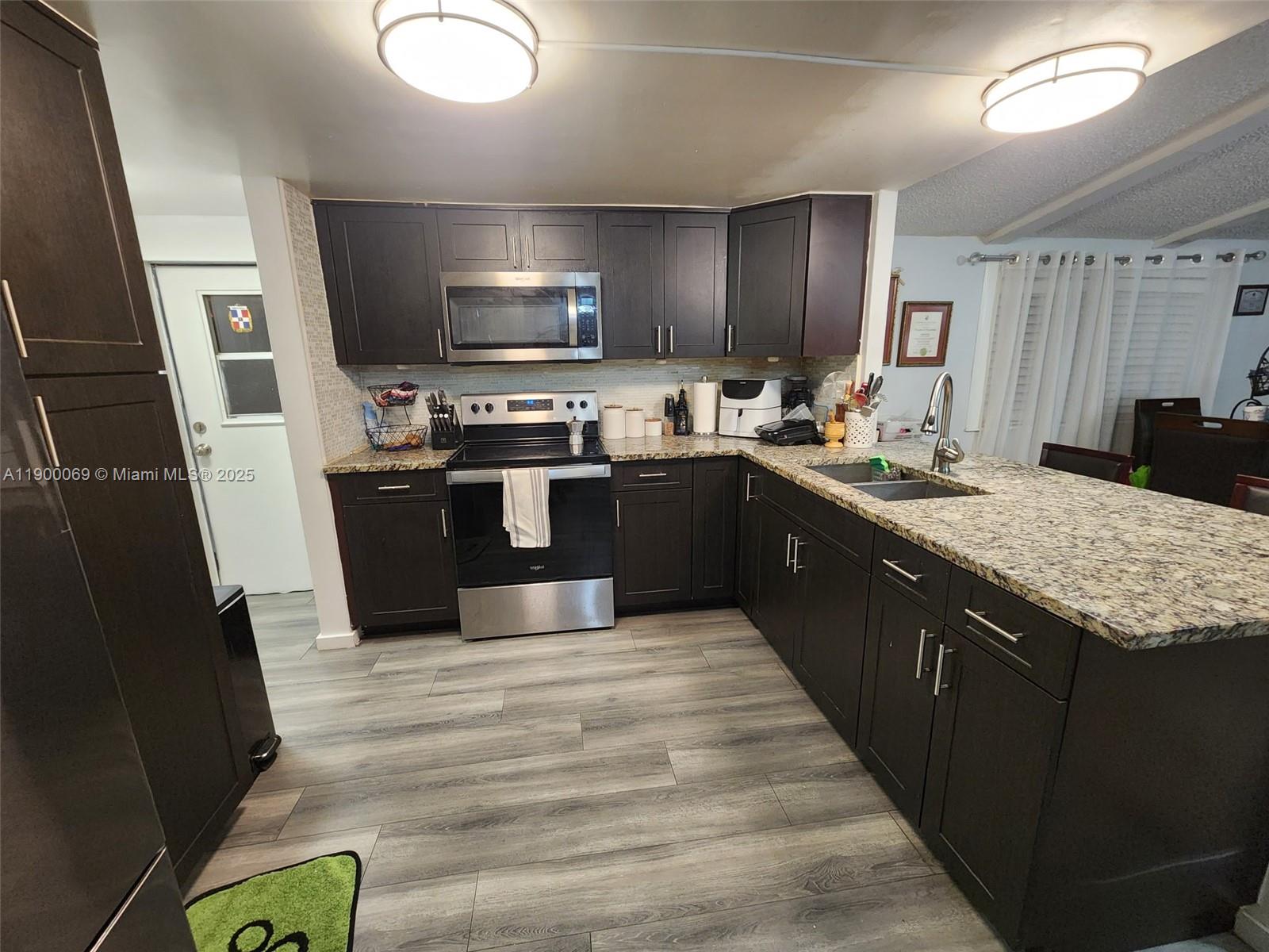 Come see this amazing opportunity to own a mobile home where you own the land. All ages welcome! Kitchen with stainless steel appliances, walk in closets, floors and baths have been remodeled. Roof was redone March 2021. Low HOA at $103 monthly. Property can be rented. Property has covered parking space and yard that has no neighbors behind. There is a community pool, basketball court and gym. Centralized and close to A schools like Chapel trail elementary, Silver trail middle and West Broward High.