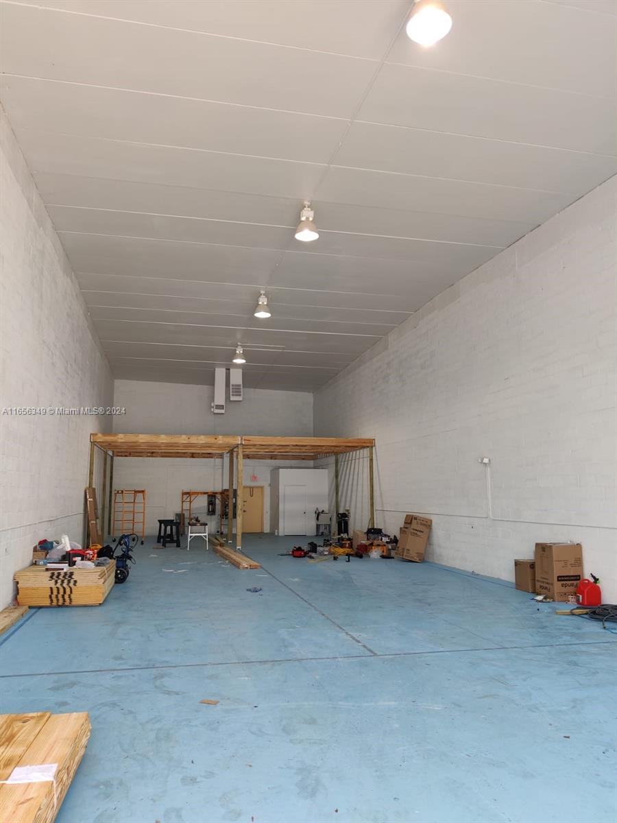 This 3,850sqft unit is built with durable concrete block construction and features a spacious garage door measuring 14 feet in height and 12 feet in width. The interior boasts a ceiling height of 22 feet, complemented by a robust concrete T-roof. The warehouse is fully air-conditioned and includes a private restroom. The property offers three dedicated parking spaces at the front and is enhanced with new LED lighting. Additionally, it includes a wood deck spanning approximately 981 sqft included in the total area.
Equipped with two air conditioning units, this versatile space is well-suited for a luxury car dealership, high-end storage, or light industrial use.