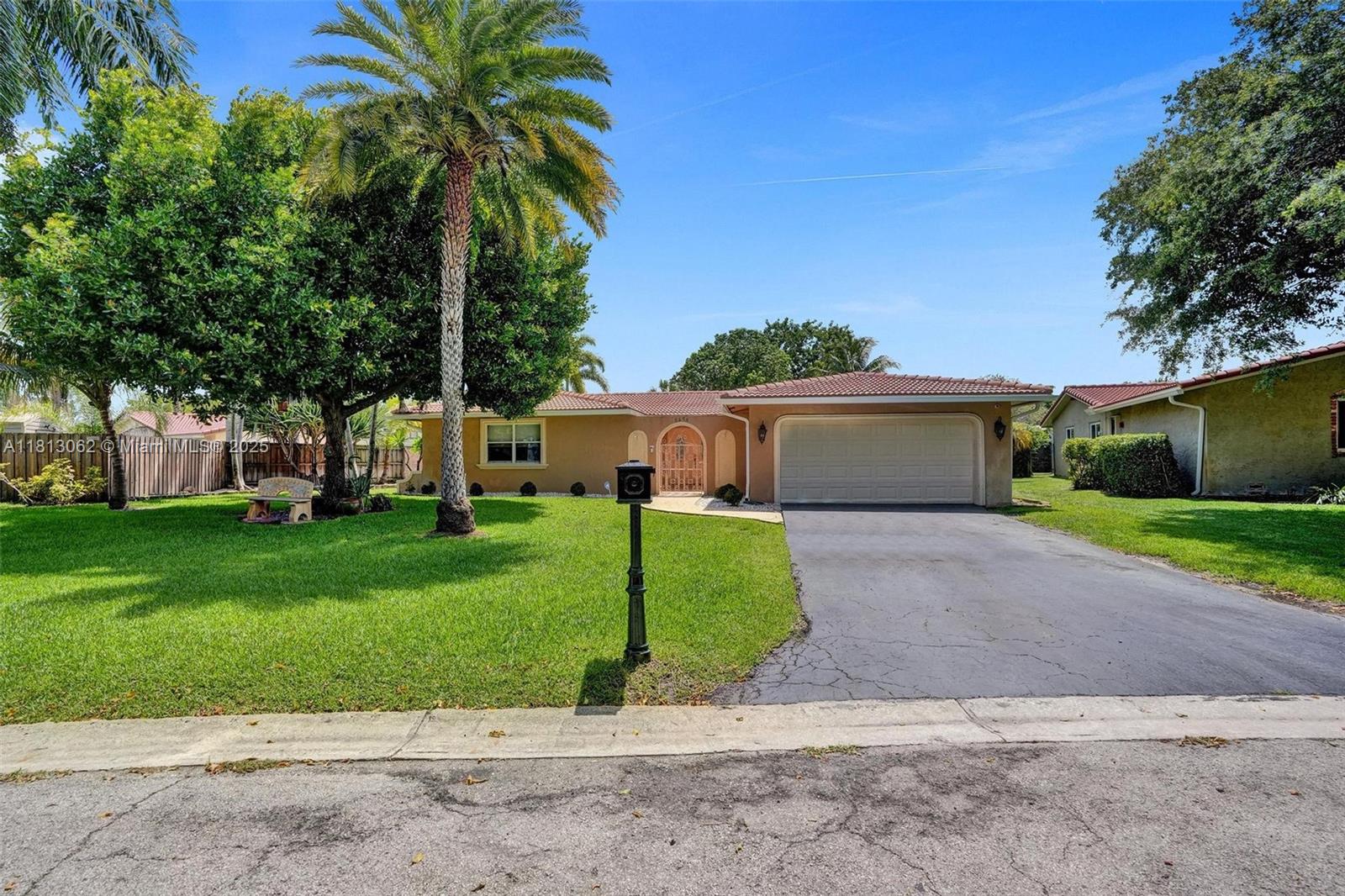 Sprawling 4 BD | 3 BA pool home on an oversized 11,000+ SQFT lot—fully renovated and move-in ready! Featuring brand new porcelain floors throughout, a stunning chef’s kitchen with 58 custom cabinets quartz countertops, and stainless steel appliances. The expansive layout offers a formal living room, dining area, and a separate family room—perfect for entertaining. Enjoy peace of mind with a 2008 roof 2022 A/C, impact windows accordion shutters upgraded security camera system and built-in speakers Step outside to a backyard oasis with a massive 20x40 pool ideal for South Florida living. Additional features include a 2-car garage, full sewer connection (no septic), and no HOA.