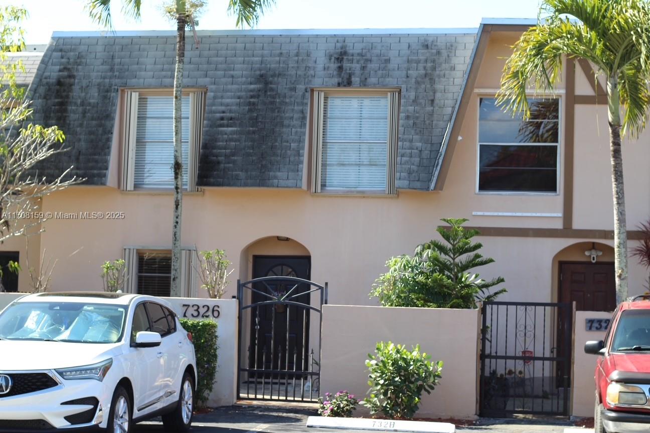 Spacious townhouse located in the heart of Davie with a great location and open floor plan, big eat in kitchen, 1/2 bathroom first floor and 2 full bathrooms second floor, separate laundry room and a huge living/ dining room looking overlooking enclosed patio. fence back yard, with a gazebo. all bedrooms are upstairs. 2 assigned parking spaces in front of unit. the maintenance fee also includes roof and exterior maintenance. NEW ROOF 2024 AND SPECIAL ASSESSMENT PAID IN FULL