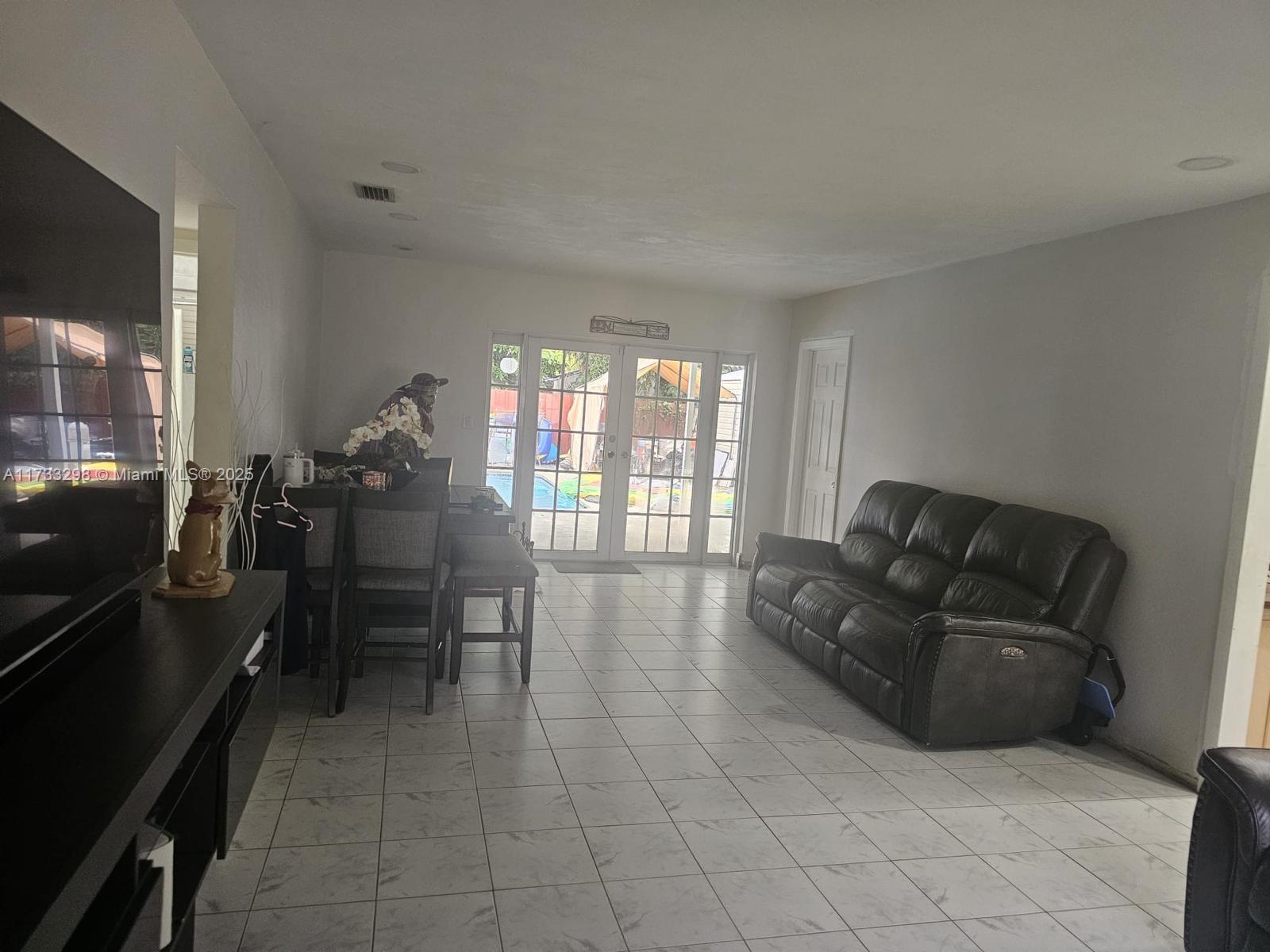 Beautiful property well treated in the desirable neighborhood of Whispering Pines at Cutler Bay. The concrete driveway on the side is great for parking any type of car, boat, RV, truck, etc. A converted garage with a private entrance is very practical for storage.