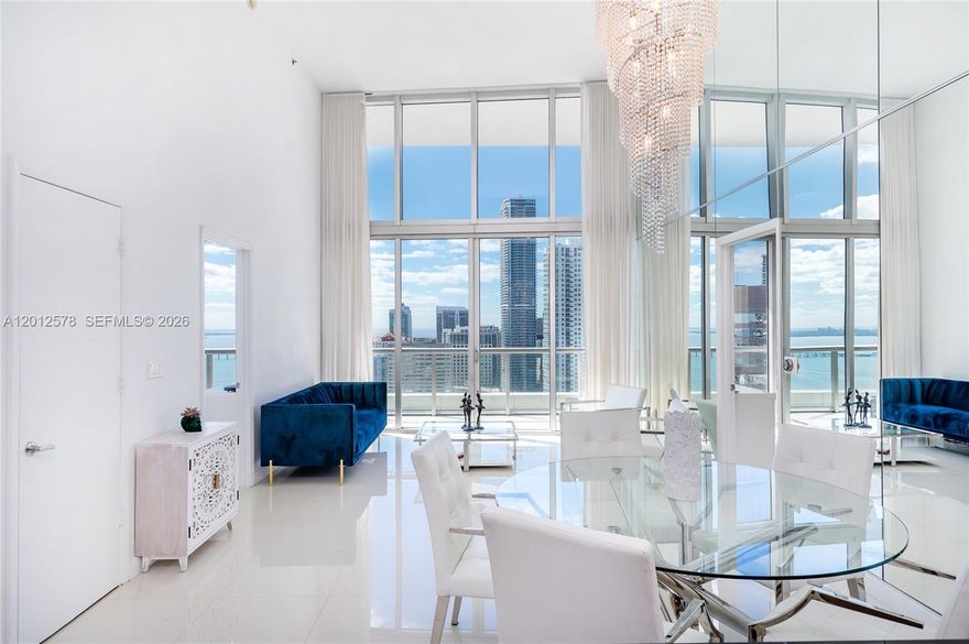 Experience refined, high-rise living in this exceptional double-height residence at Icon Brickell Tower II. Perched on a high floor, this striking unit showcases soaring ceilings and expansive floor-to-ceiling impact glass, capturing breathtaking city and water views while flooding the interiors with natural light. The open-concept design is enhanced by sleek, contemporary finishes, a designer kitchen with premium appliances, and a grand living space ideal for both sophisticated entertaining and everyday comfort.

Positioned along the Miami River at the gateway to Brickell, Icon Brickell delivers a true resort lifestyle with a world-renowned pool deck, full-service spa, state-of-the-art fitness center, valet, and curated on-site dining including Cipriani, La Cantina. Residents also enjoy access to Cipriani’s exclusive private dining venue, The Living Room, located downstairs, a discreet extension of luxury living.