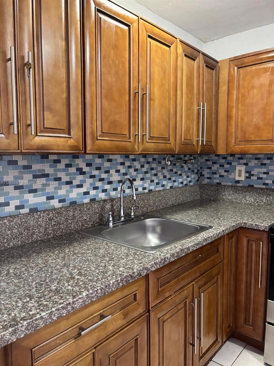 Recently updated 2-bedroom unit in the gated community of Montecarlo. Features a modern kitchen with stainless steel appliances, ceramic tile flooring throughout, and convenient same-floor laundry. Community offers a pool and secure access. Ready for immediate move-in!