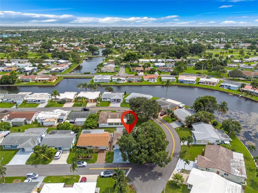 Beautifully maintained 2 bedroom and 2 bath house in a desirable 55+ community. This lovely corner home has a well-maintained kitchen with almost new appliances including a washer and dryer. Attached is a car garage with a big driveway for additional parking. A/C was installed in 2023 and the roof was replaced in 2016. Low HOA that includes the Landscaping and provides plenty of activities and events. A MUST SEE...! Close to main highways and shopping centers.