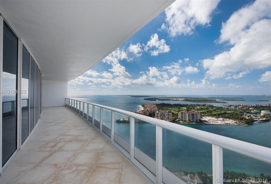 Life is splendid at exclusive Continuum on S. Beach, & the bird's eye view magnificent from this 38th floor residence overlooking Port of Miami, Fisher Island, & Biscayne Bay. 'Paradise Found' includes 12+ acres of oceanfront w/ beachside service, 3 resort-style pools, spa & fitness centers, 24hr concierge & valet, & fabulously appointed condo w/ private elevator entry. Walls of glass, marble floors, beautiful custom baths w/ mosaic inlays, & sleek Euro kitchen are only the beginning.See for yourself!