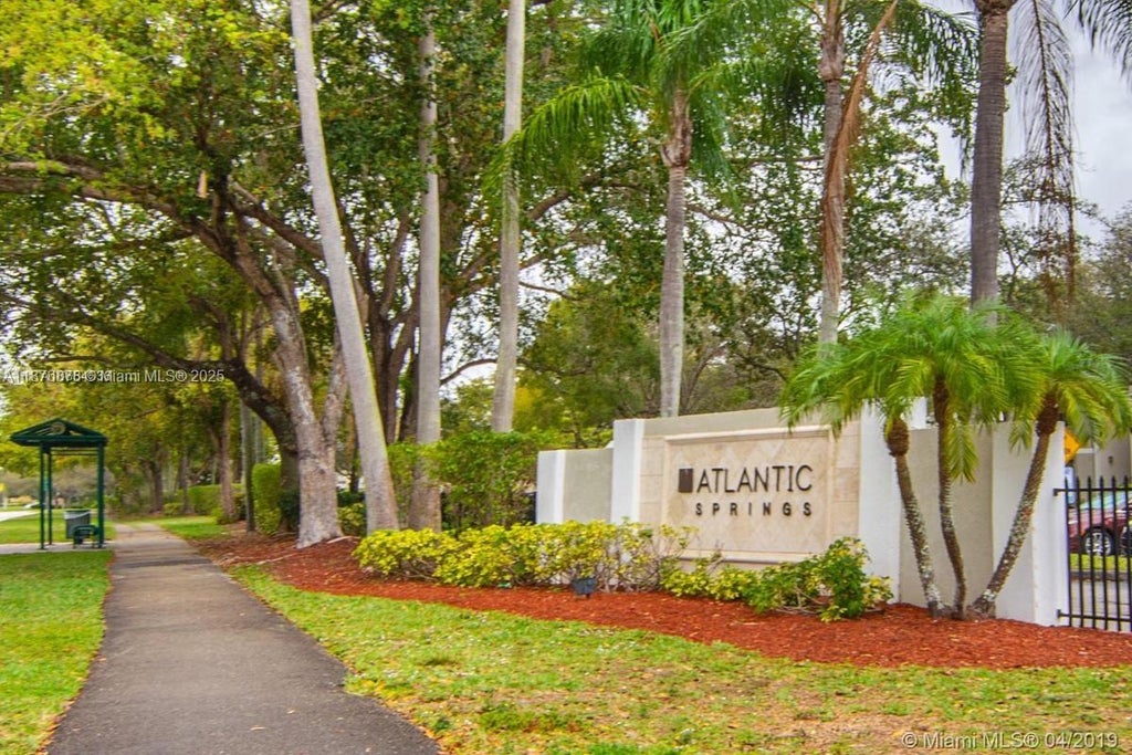 Photo of 11263 W Atlantic Blvd #108, Coral Springs, FL 33071 (MLS # A11876878)