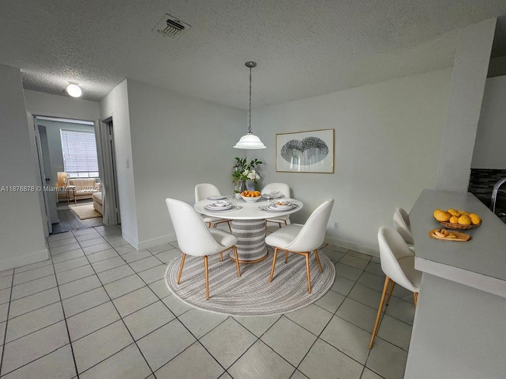 Photo of 11263 W Atlantic Blvd #108, Coral Springs, FL 33071 (MLS # A11876878)
