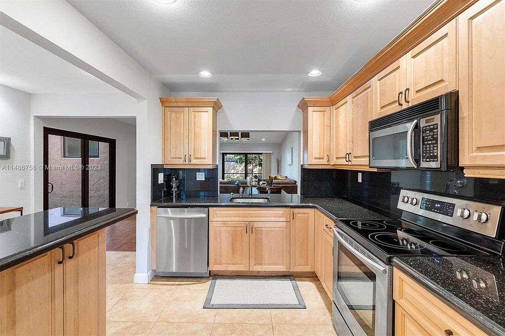 Photo of 974 NW 79th Ter, Plantation, FL 33324 (MLS # A11486758)