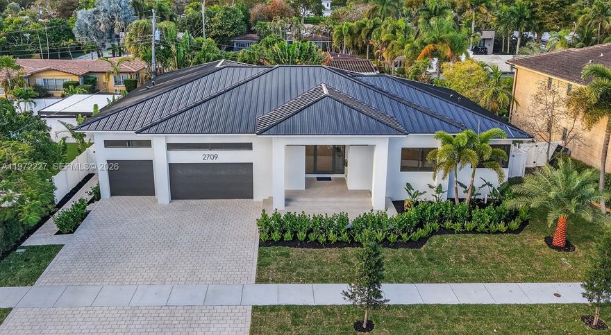 A rare opportunity to secure a brand-new Coral Ridge estate with built-in financial leverage. Experience 4,250 SQ FT under roof by renowned 3rd-generation builder Tim Lang. This newly completed residence offers exceptional value for a 4-suite home in an elite enclave where surrounding estates reach $16M+.

Seller financing available with $700K down at 7% over 30 years for qualified buyers, creating a limited opportunity in today’s market.

Step inside to 48" designer flooring and a fully integrated smart home with iPad-controlled lighting, climate, pool, and pre-wired Sonos. The chef’s kitchen features an 11’ Golden Belly quartz island, Miele induction appliances, and a 113-bottle wine cooler.

Two expansive 16’ impact sliders open to a resort-style pool and spa. All bedrooms are private suites with custom closets. The Owner’s Suite features a pivot entry and spa-style wet room with Roman tub.

3-car garage with EV charging and lift potential. Built at 8.5’ elevation with full impact glass. Furniture & TVs included. Minutes to golf, beach, yacht club & dining. Bayview Elementary.