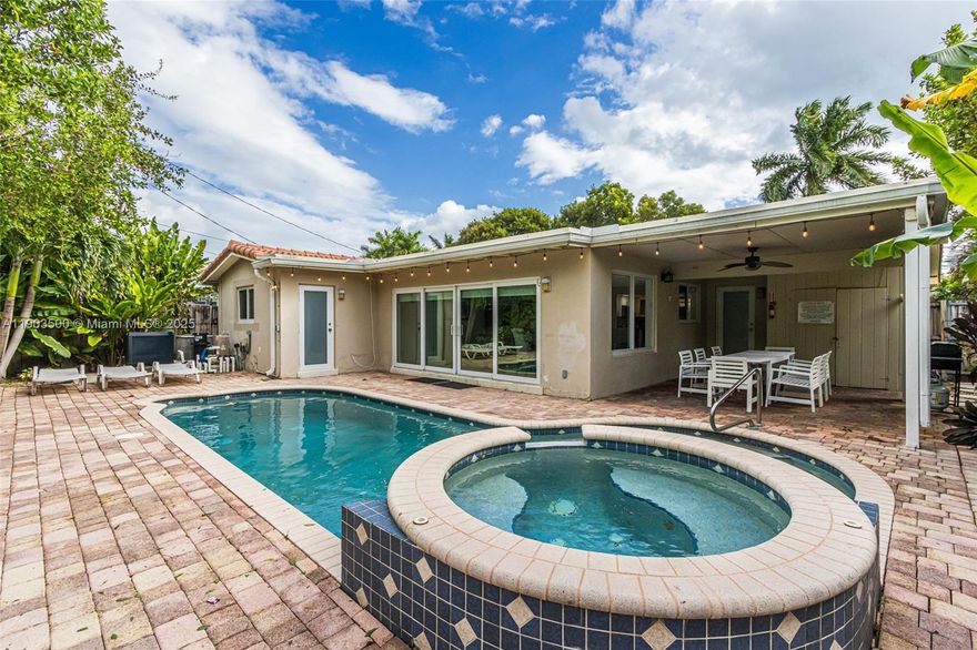 This property features four bedrooms and three full bathrooms, situated in East Hollywood. It includes a heated pool and hot tub, as well as impact-resistant windows. Conveniently located near downtown Hollywood, it offers easy access to the renowned Hollywood Beach and Broadwalk.