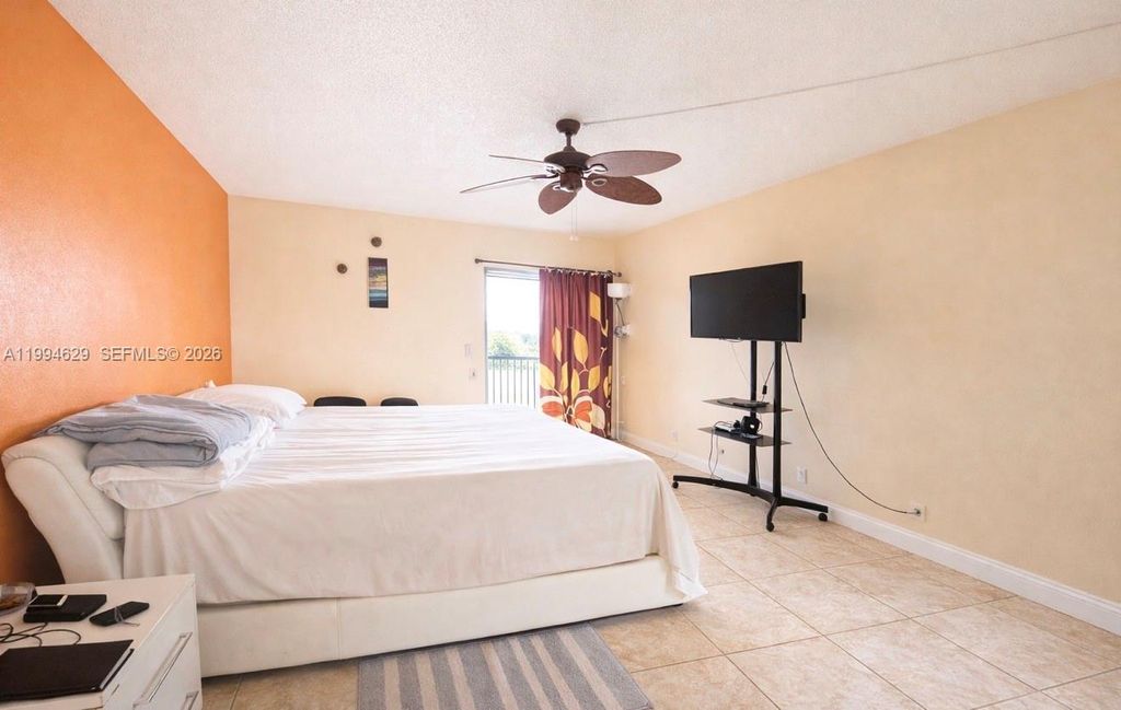 Photo of 6575 W Oakland Park Blvd #311, Lauderhill, FL 33313 (MLS # A11994629)