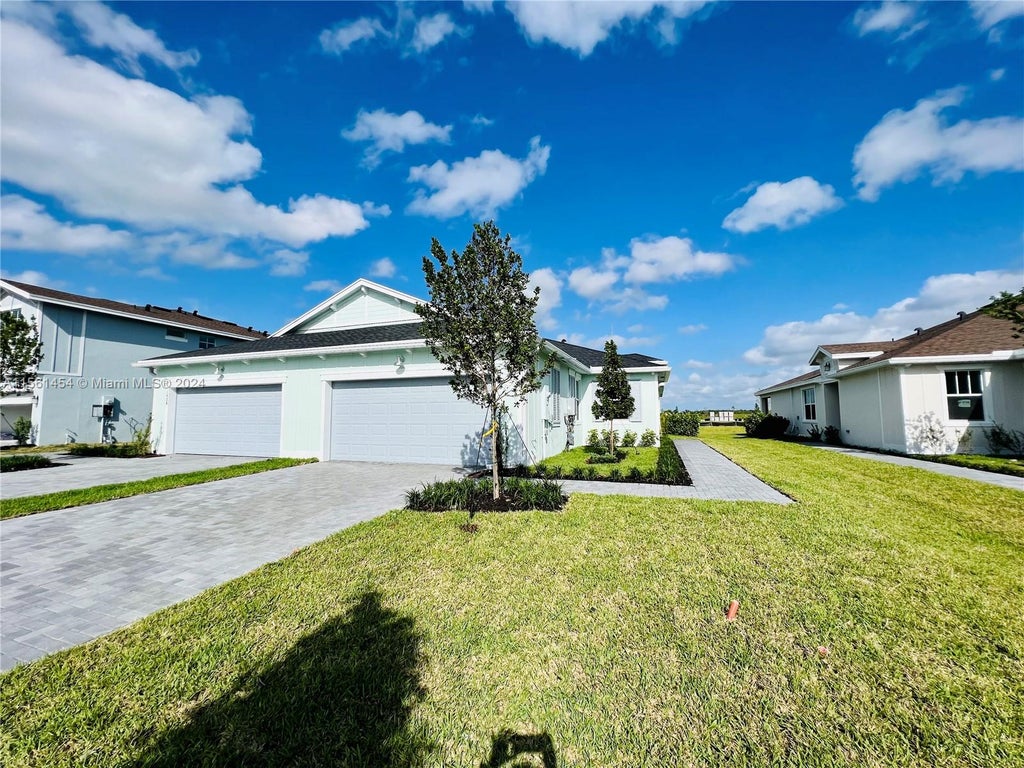 Photo of 1424 Haywagon Trl #1424, Loxahatchee, FL 33470 (MLS # A11561454)