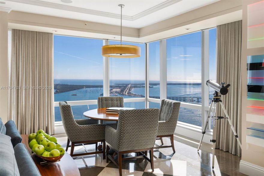 An exquisitely designed corner unit in the prestigious Four Seasons Residences, offering 5,423 SF of refined luxury. This 4-bedroom, 4-bathroom, 2-half bathroom home is filled with natural light through floor-to-ceiling impact glass, showcasing breathtaking Bay views. The gourmet kitchen features Wolf and Sub-Zero appliances, a spacious cooking island, and bespoke high-end finishes. Three elegant balconies provide stunning outdoor spaces, while premium flooring and custom details elevate the elegance. Residents enjoy Five-Star Four Seasons amenities, including two heated pools, a full-service spa, Equinox gym, private lounges, 24-hour concierge, valet, and in-residence dining—the pinnacle of sophisticated, resort-style living.