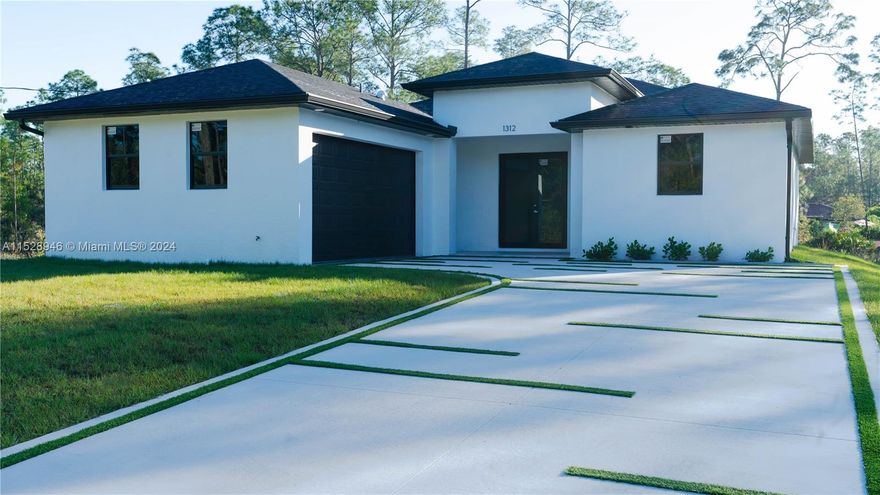 Discover elegance and modern comfort in Lehigh Acres with this stunning new construction, ready for move-in. Nestled on a spacious half-acre lot, this home offers 3 bedrooms, 2 baths, and a 2-car garage, designed with high ceilings and luxurious upgrades. Enjoy an oversized lanai, 40-gallon water heater, 3.5-ton central AC, high-impact windows and doors, tile floors, and a contemporary kitchen with quartz countertops. Equipped with 5 ceiling fans for added comfort, this home is one of many available locations for your perfect start. Don’t miss the chance to make this dream home yours.