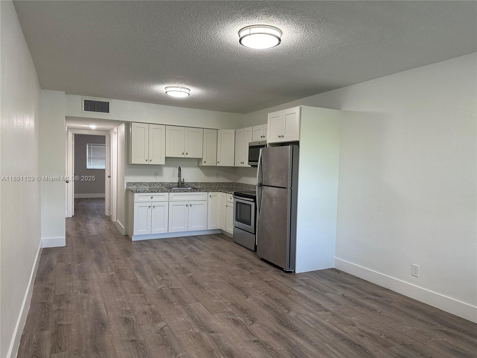 BRAND NEW, 1-BEDROOM/1-BATH APARTMENT IN BEAUTIFUL COMPLEX - GREAT NEIGHBORHOOD AND CENTRALLY LOCATED IN HOLLYWOOD! This spacious unit features new flooring, new lighting + kitchen and bathroom upgrades. Fully remodeled, second floor unit in a peaceful, well-maintained building. Also includes central AC and 1 assigned parking space. Laundry is onsite. Water, waste, sewer included in rent as well as pest control and maintenance. Pets welcome with small non-refundable pet deposit. Property is tucked away on a cute, quiet street but also walking distance to shops, restaurants, and close to Downtown Hollywood, Art Walk, Hollywood Beach Golf Club, Young Circle Park, Major highways such as A1A, US1, I-95 etc. Highly desirable area - < 10 mins from Hollywood Beach. Great parks and schools nearby!