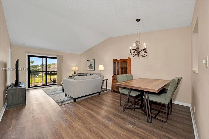 Beautiful second-floor condo located in the tranquil, gated Boca Cove community—open to all ages. This well-designed unit features a desirable split floor plan with two spacious bedrooms and large closets. The kitchen is equipped with stainless steel appliances, along with a full-size washer and dryer for added convenience. Laminate flooring runs throughout the main living areas, with tile in the bathrooms. Step out onto the screened-in balcony and enjoy peaceful canal views. Major updates include a brand-new roof (2024), AC unit (2023), and water heater (2025), along with copper plumbing for added peace of mind. Perfect as a starter home or investment property, with immediate rental availability. Residents enjoy great community amenities, including a clubhouse, pool, tennis courts, BBQ area, and fitness center. Pet-friendly and located in a top-rated school district—this is Boca living at its finest.