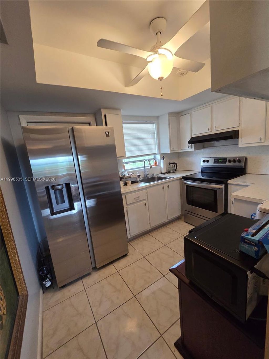 Photo of 410 NE 17th Ave #203, Boynton Beach, FL 33435 (MLS # A11998535)