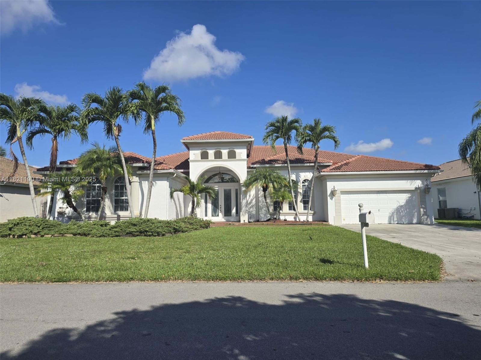 Stunning lakefront home in Fairways at Keys Gate, the largest in the community with unmatched space and luxury. This one-story home features open living areas, soaring ceilings, marble, ceramic & wood floors, chef’s kitchen with island & breakfast bar, formal living/dining, and a spacious primary suite with spa-style bath. Enjoy a screened heated pool overlooking the lake, perfect for entertaining. Impact windows, 2-car garage, landscaped grounds. HOA includes internet, cable, ADT monitoring, patrol, tennis/racquet courts, 24-hr security. For a small fee, you can join the Royal Palm Club with clubhouse, gym, pool, library, study/work areas, showers, lockers, ping pong room, billiards, bar area, saunas, and jacuzzi.