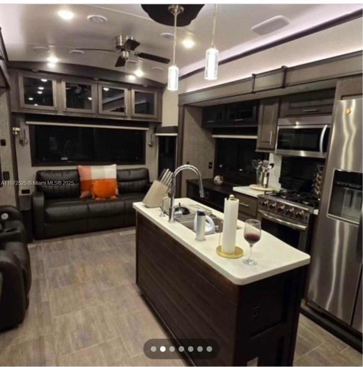 Cozy RV available for monthly rental in a quiet property setting. Features 1 bedroom, 1 bathroom, living room, dining area, and kitchen. Ideal for a single person at $1,200/month, or for a couple at $1,400/month. Fixed monthly rent includes water, electricity, and internet. Convenient location with a private setting. Perfect for long-term tenants seeking comfort and affordability.