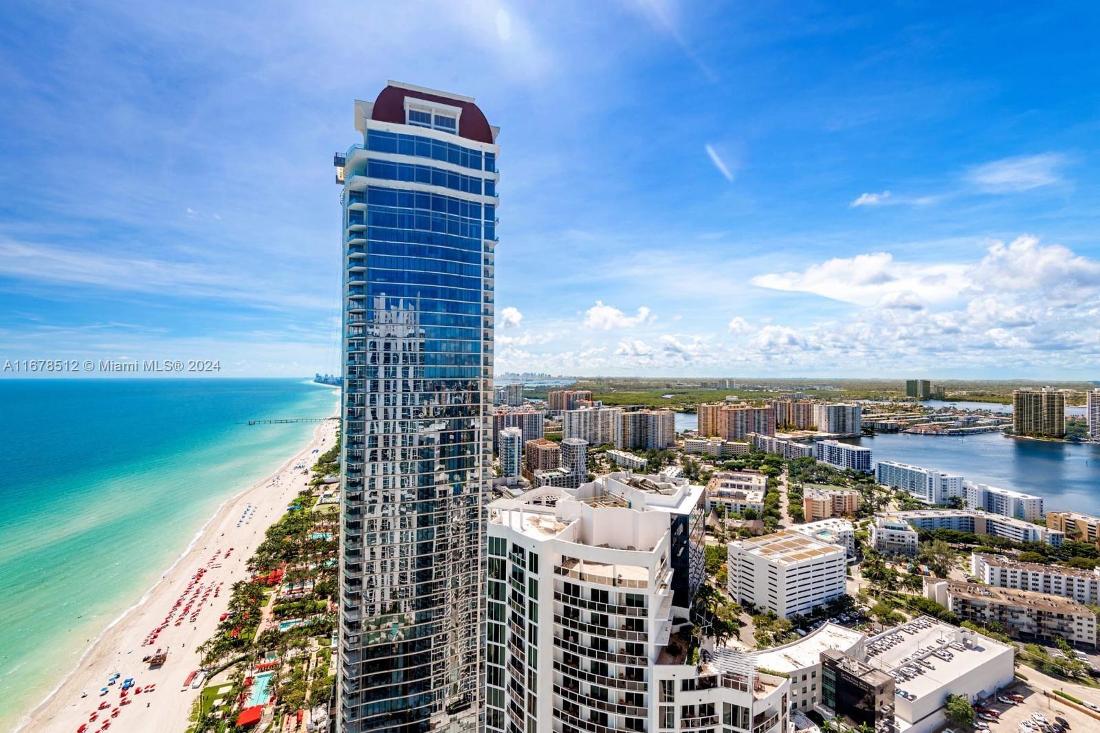 The most spectacular turn-key penthouse in Sunny Isles Beach. Incredible direct views all around-direct ocean, intracoastal & sunset. Approx 1,500 sf with two bedooms, living room, kitchen, plus a huge balcony. Fully loaded with sound, audio, electric shades & climate controls. Includes all furniture (except artwork), upgraded with marble floors. Modern finishes with beautiful furniture included. Amenities, including a tennis courts; gated entry with a 24-hour attendant; a two-story lobby entrance; a temperature-controlled lagoon pool; two temperature-controlled lap pools; Jacuzzis; a bar & grill; waterfalls; on-site restaurants; & an 8,000-square-foot spa & fitness center featuring state-of-the-art fitness equipment, saunas, steam rooms, massage treatments rooms, and so much more.