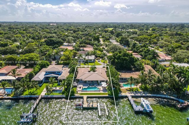 Stunning Waterfront Property in the prestigious neighborhood of Miami Shores. Seating on bay facing East of Miami Beach. Fully Furnished From Restoration Hardware. 5 Bedrooms, 4.5 Baths, renovated, Oversized Lot, Heated Infinity Pool With Auto Refill, Natural Gas Generator. New Boat Lift That Can Hold Any Boat, Dock Has Electric & Water. Open Floor Plan With Amazing Bay Views. Huge Eat-in Kitchen, Walk-in Pantry & Big Laundry Room With Extra Fridge & Dishwasher. Master Bedroom Overlooks the Bay; Big Walk-in Closet & Spa Like Bath With Dual Sinks, Soaking Tub & Large Shower. Attached 2 Car Garage With a/c. Security System, Impact Windows, Sound System Inside and Out, Floor to Ceiling Impact Glass, and Stunning Unobstructed Bay Views.