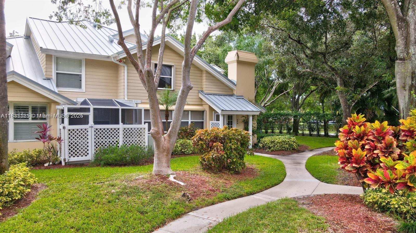 Beautifully updated townhouse for sale in the only community in the Meadows with a 24/7 manned gated entrance. This home comes with a brand new A/C, dishwasher, and screen enclosure with hard roof (w/permit). A digital keypad, nest thermostat, ring doorbell system, and a 75" Sony TV are all included. Metal roof and accordion shutters on the entire home provide safety and optimal insurance savings. Enjoy the fully renovated kitchen with matching GE appliances and soft close cabinetry. The two assigned parking spaces are adjacent to the walkway leading to your front door. A stunning White Oak glass staircase compliments the vaulted ceilings at the center of the home and the impressive built-in closet in the upstairs bedroom adds to the surplus of storage throughout the home. FHA approved.