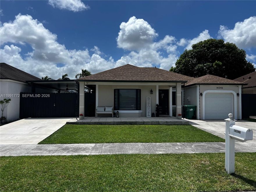 Stunning fully remodeled 3BR/2BA home in West Kendall. This move-in ready property features modern tile flooring, renovated kitchen and baths, and complete impact windows and doors, including garage door. Enjoy a private backyard with artificial turf and pergola, ideal for entertaining. Exterior security camera system installed. New roof and A/C (2022). One car garage with laundry and storage cabinets.