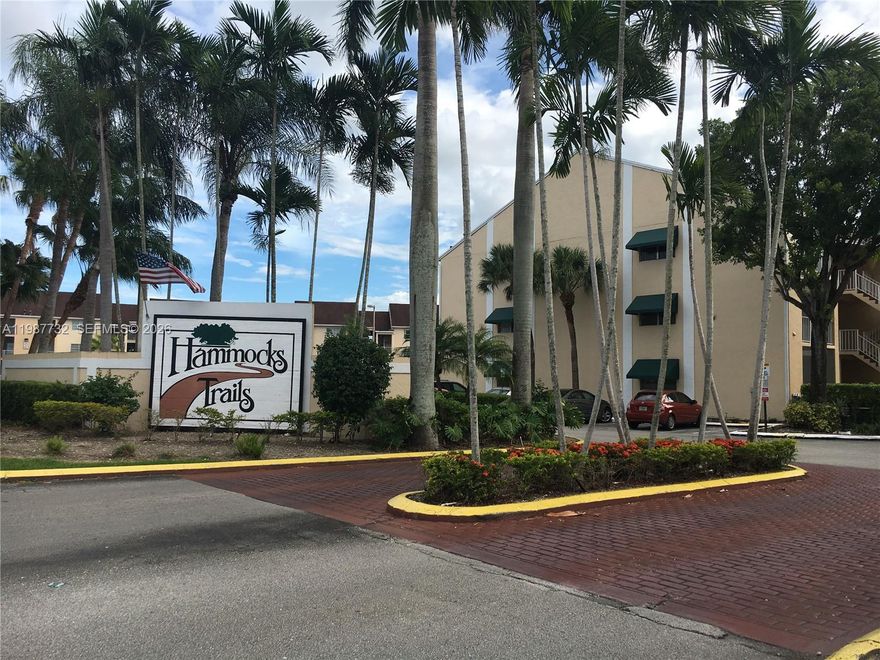 Charming & cozy 1-bedroom, 1-bath corner condo ideally located in the heart of the Hammocks. This inviting unit features a spacious private balcony perfect for relaxing or entertaining. Interior highlights include tile and laminated wood flooring through out, as well as the convenience of a full size washer and dryer. Please note: The building does not have an elevator.