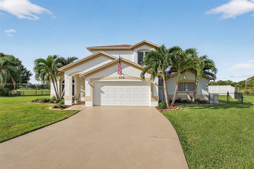 YOUR WAIT IS OVER..... CUSTOM BUILT 3 Bedroom + Loft, 2.5 Bath, Lakefront, Pool Home in Sought After Crestwood at Royal Palm Beach.  Features an Inviting Floor Plan, Open Kitchen, Maple Cabinetry, Granite Countertops, Serving Bar, Newer Appliances, ENORMOUS CUSTOM MASTER SUITE, Oversized Walk-in Closet, Spa Style Bath, Dual Sink Vanity, Jetted Jacuzzi Tub, Enormous Zero Entry Accessible Shower w/Dual Heads, Mixing Valves & Bench Seat, Generous Guest Rooms, Vaulted Ceilings, Neutral Flooring, IMPACT WINDOWS & DOORS, Accordion Shutters, Private Covered & Screened-in Patio, REFRESHING FREEFORM - SOLAR HEATED - SALT POOL, Fenced Grounds, Tropical Landscaping, Located on a Secluded Cul-De-Sac Street. ***NO HOA*** 2017 Roof, 2022 A/Cs, 2022 W/H, 2017 Pool Remodel, 2001 Windows, 2005 Doors.