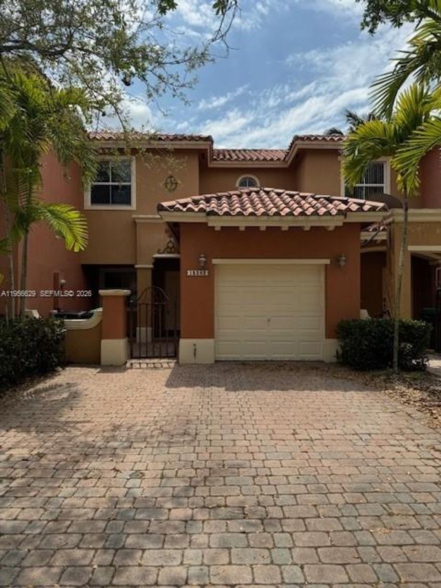 BEAUTIFULLY MAINTAINED 2BD /2.5 BA MEDITERRANEAN STYLE TOWNHOME IN QUIET, GATED COMMUNITY OF VENETIAN ISLES (TOSCANA).  FEATURES A GATED COURTYARD ENTRY, COVERED FRONT PORCH, AND BRIGHT OPEN LAYOUT WITH TRAVERTINE FLOORS, CROWN MOLDING, TRAY CEILINGS, AND STYLISH FIXTURES THROUGHOUT. INVITED LIVING AREA, UPDATED OPEN KITCHEN WITH TWO-TONED SHAKER CABINETS, QUARTZ COUNTERTOPS, MODERN APPLIANCES, FARMHOUSE SINK, AND AMPLE CABINET SPACE. SPACIOUS DINNING AREA OPENS TO OVERSIZED PRIVATE FENCED PATIO, IDEAL FOR ENTERTAINING. UPSTAIRS PRIMARY SUITE OFFERS LAMINATE PLANK FLOORING, TRAY CEILING, WALK-IN CLOSET, AND UPDATED PRIMARY BATHROOM. THE SECOND BEDROOM IS GENEROUSLY SIZED WITH TASTEFULLY UPDATED 2ND BATHROOM. DEDICATED LAUNDRY ROOM WITH NEW MODERN WASHER AND DRYER, 1 CAR GARAGE PLUS EXTENDED DRIVEWAY. RESORT STYLE AMENITIES INCLUDE GORGEOUS COMMUNITY POOL, CLUB HOUSE, WITH CASCADING FOUNTAINS AND GARDEN VIEWS, KIDS PLAYGROUND AREA AND VOLLEYBALL COURTS. WELL KEPT FAMILY FRIENDLY, NEAR GREAT AREA SCHOOLS, SHOPPING AND MAJOR ROADWAYS. AVAILABLE FOR OCCUPANCY APRIL 1, 2026.