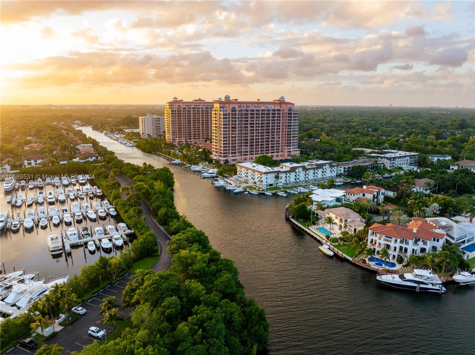Boating enthusiasts will appreciate the 40-foot+ slip providing direct, bridge-free access to the pristine waters of Biscayne Bay. Located where Coral Gables, Coconut Grove, and Biscayne Bay meet, this 2-bedroom, 2-bathroom ensuite residence offers a luxurious retreat in Miami's sought-after landscape. Savor stunning sunrises from private balconies perfect for open-air dining, entertaining, or unwinding with a drink. Inside, the residence is designed with generous storage space and hurricane protection for added peace of mind. Enjoy gated security, a waterfront pool, and covered parking among other amenities. This property is a rare gem for those seeking elegance and convenience in one of Miami's premier locations.