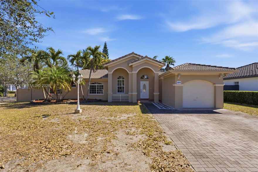 Welcome to West Kendall! This charming 3-bedroom, 2-bath single-family home features a spacious living area and an updated kitchen with stainless steel appliances. Enjoy a large backyard with a covered patio, perfect for relaxing or entertaining. Situated on a desirable corner lot with a one car garage and no HOA. Located in a quiet, well-established neighborhood close to well-rated schools, parks, shopping and major roadways. Great opportunity, schedule your showing today!