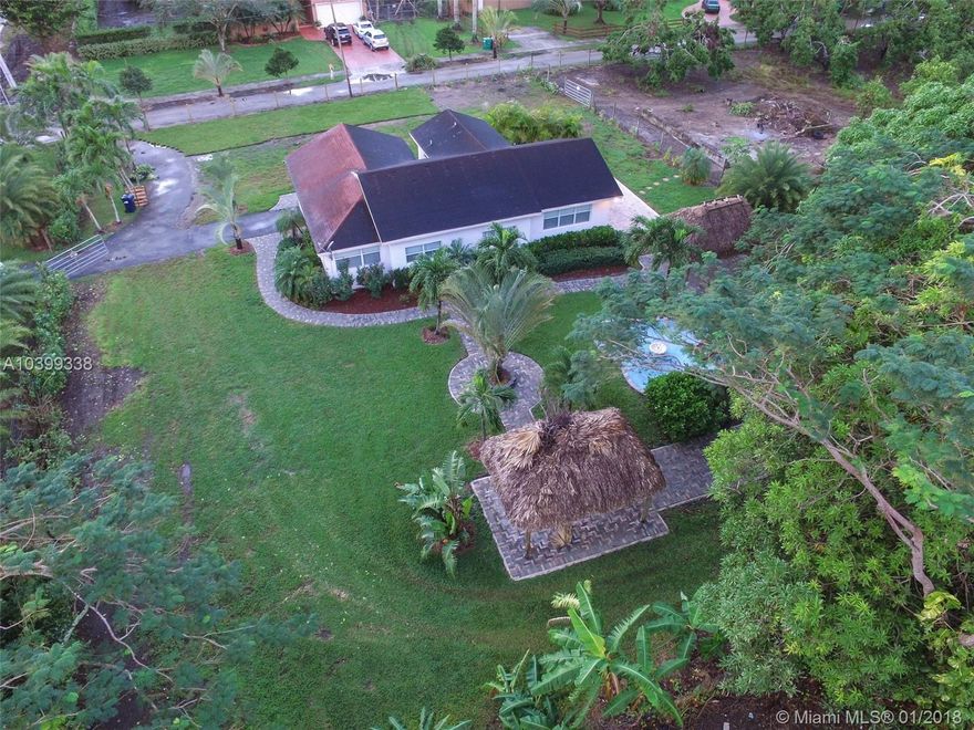 Great opportunity to live on five acres in the Redland area! This home was recently updated in 2013. The property boasts lush landscaping, income producing fruit trees, a large fountain, and much more on this expansive five acres of land. It rents for $2000 (includes lawn service) for just the house or $3500 for the entire 5 acres (this includes the income producing avocado trees and NO lawn service). Call me to see your tropical oasis!