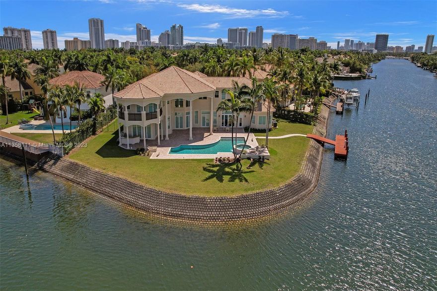 One-of-a-kind waterfront custom built home has everything you would expect. Over 10,000 sf on a spectacular 26,187sf lot with 280' of waterfront. 7 bedrooms, 7.5 baths + office , gym & playroom. Features include a 4-car garage, indoor squash court, elevator & a private dock with ocean access. Spectacular outdoor space with summer kitchen, enormous covered patio and an oversize heated pool with spa. Steps to a 20-acre park with biking and jogging trails. This luxury waterfront community offers a marina, clubhouse, parks, tennis, and basketball courts, 24-hour security patrol and fitness center.