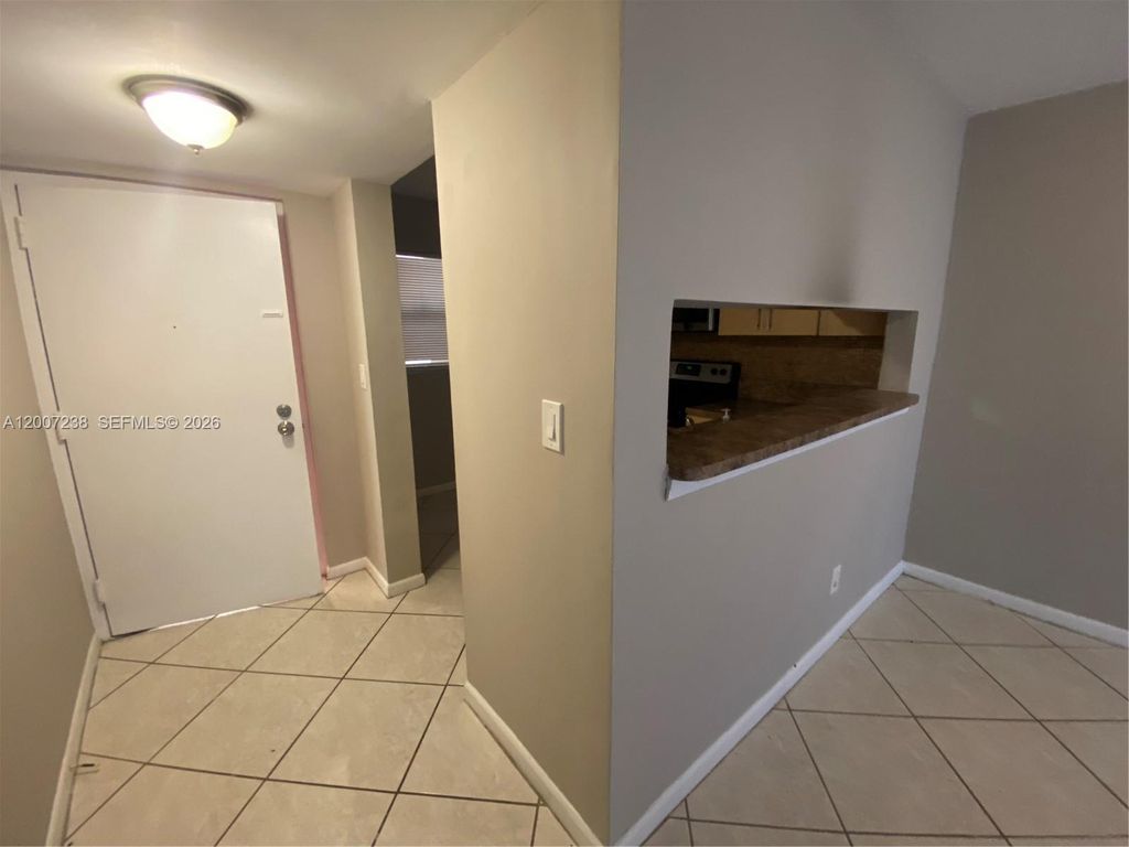 Photo of 3399 Foxcroft Rd #103, Miramar, FL 33025 (MLS # A12007238)