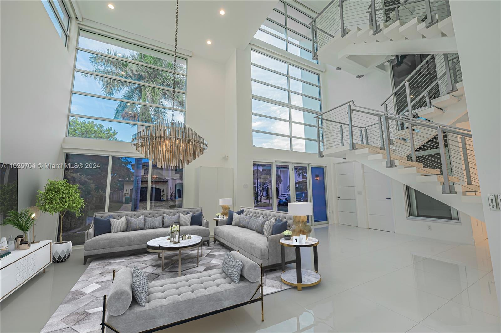 Welcome to Golden Shores most spacious and sleek three story smart home boasting a total of 6,442sf under AC. The open kitchen features top-notch Sub- Zero, Wolf, and Miele appliances, along with stone countertops and custom Mia Cucina cabinetry. The third-floor master-suite spans nearly 2,000SF , offering custom double walk-in closets, a separate office area, and floor-to-ceiling windows overlooking tropical landscaping. A rooftop deck with a TV and audio system adds an extra layer of luxury. The primary bath features marble floors, a slate shower, and double vanities. The private pool area sits on a custom wood deck with a high- end A/V system, creating a lush retreat. Only few minutes walk from the ocean and main point of interest.
Driving Directions:
