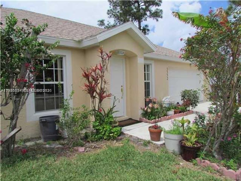 Photo of 3352 SW Himango St, Port St Lucie, FL 34953 (MLS # A11980574)