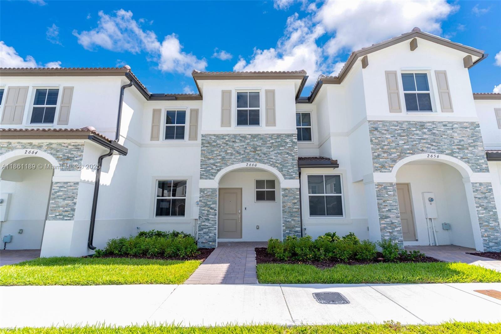 Brand-new two-story townhouse offers three spacious bedrooms, two full bathrooms, and one half-bath. The open layout features a family room/dining room, and kitchen, complemented by a separate living room for additional relaxation and entertainment space. All bedrooms are on the second floor. Kitchen boasts stainless steel appliances, quartz countertops, and ample cabinet space. Elegant ceramic tile flooring on the main level, the second floor is carpeted for added comfort. A large, fenced patio provides the perfect setting for relaxation or entertaining. Conveniently situated near schools, Turnpike Exit 2, retail shops, restaurants, a hospital, Amazon Distribution Center, and Homestead Air Base. Association approval requires 30 days, and tenants are responsible for water and electricity.