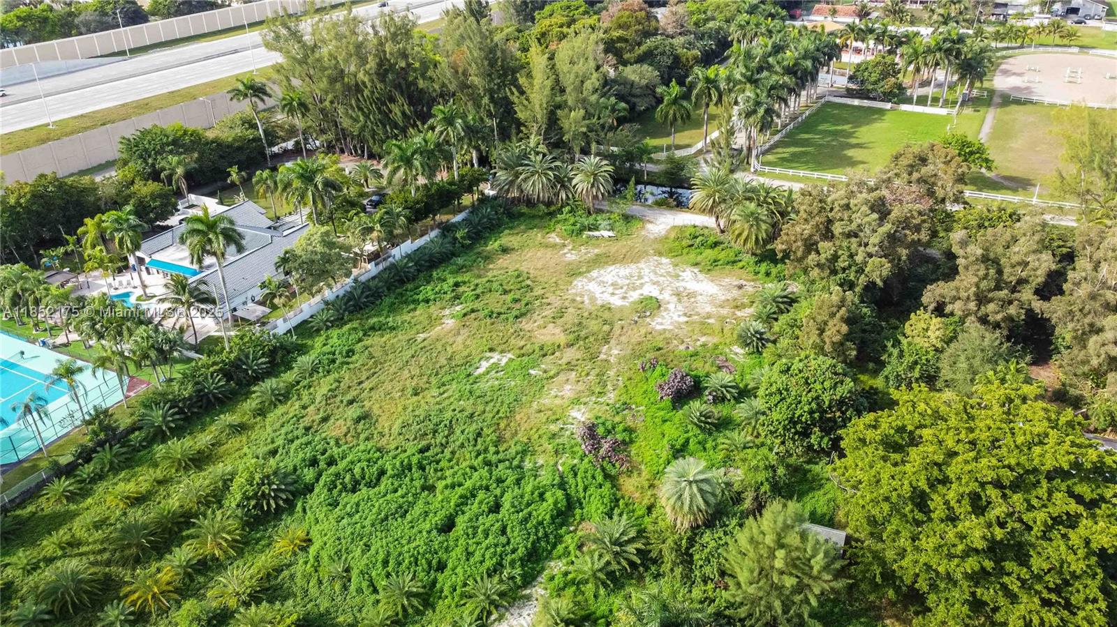 Your Design Luxury Custom Retreat on 2.5 Acres in Prestigious Country Club Ranches Welcome to a rare opportunity in one of Miramar’s most sought-after neighborhoods—Country Club Ranches.Expansive 2.5-acre cleared lot is the perfect canvas for your luxury custom estate. With over \$100,000 in fill,compacted soil, and a de-mucked site complete with an oversized house pad already in place.No HOA, allowing you to design without restrictions. Privacy, space, and serenity of country-style living while staying minutes from major highways, top-rated schools, upscale dining, hospitals, and premier shopping. Whether you're envisioning a modern sanctuary, equestrian retreat, or multi-generational estatethis property offers the space and location.New transfomer ability to connect to main city sewer.