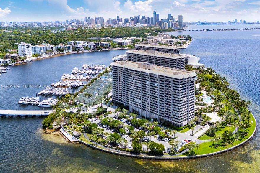 One of the most updated and least expensive units in sought after Grove Isle. Gorgeously updated and appointed large 2/2 layout with open living spaces, large primary suite and second bedroom, large terrace, laundry area and more.  Beautiful porcelain floors, stylish wood kitchen, and electronic shades.  Peaceful views and plenty of relaxing outdoor terrace space.  Enjoy the luxurious Grove Isle lifestyle which features fantastic amenities and a full service building.